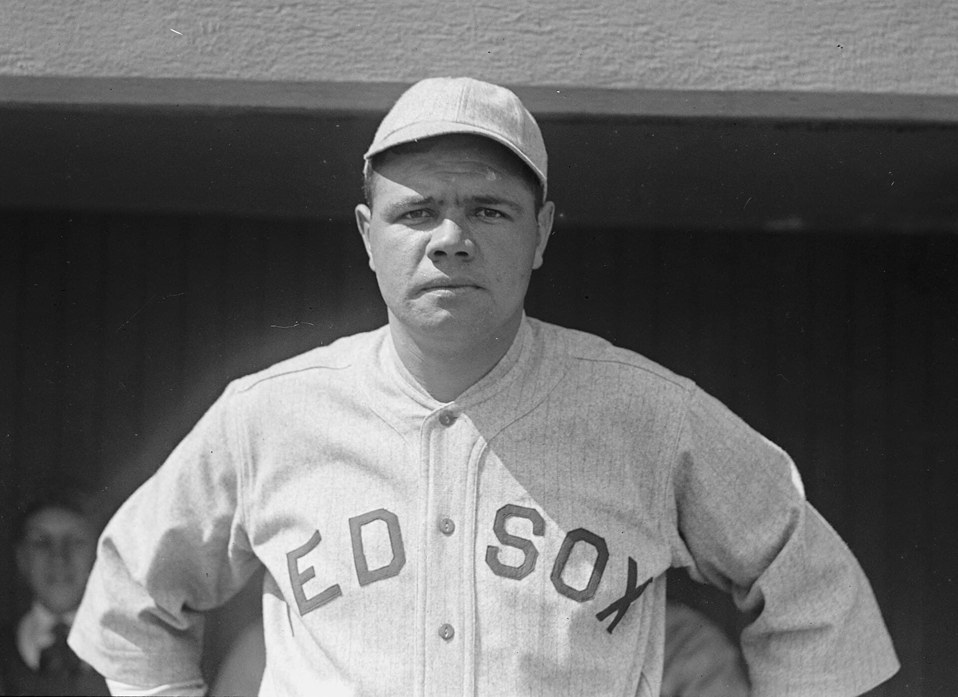 Babe Ruth in a Boston uniform in 1919, the season before the Yankees bought his contract. This is a publicity portrait, not a photograph of the sale.