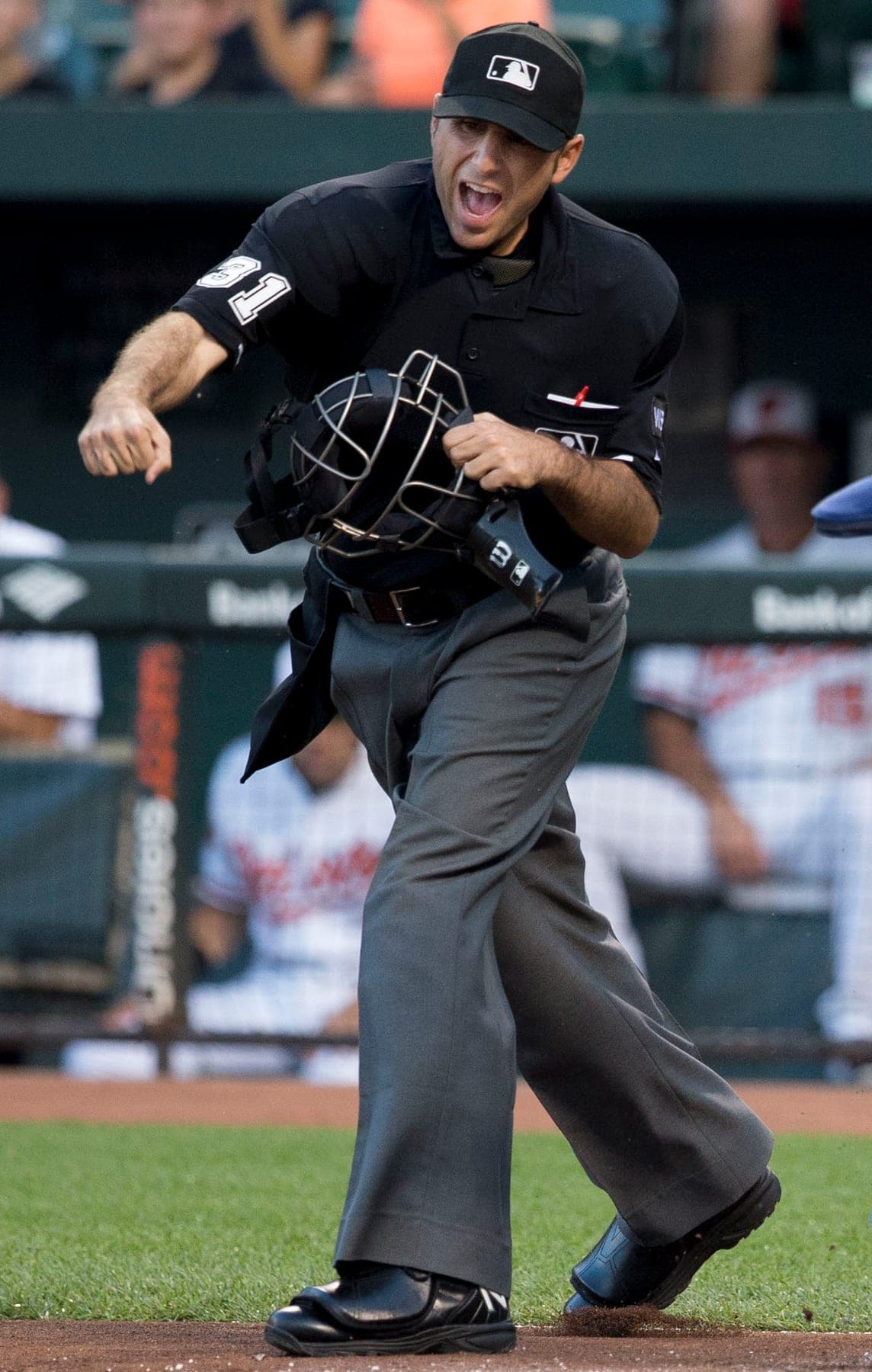 Umpire Pat Hoberg makes an out call at home plate, August 26, 2014. Not related to the firing.